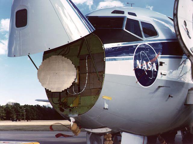 NASA airborne weather radar aircraft with radome open, showing radar antenna dish