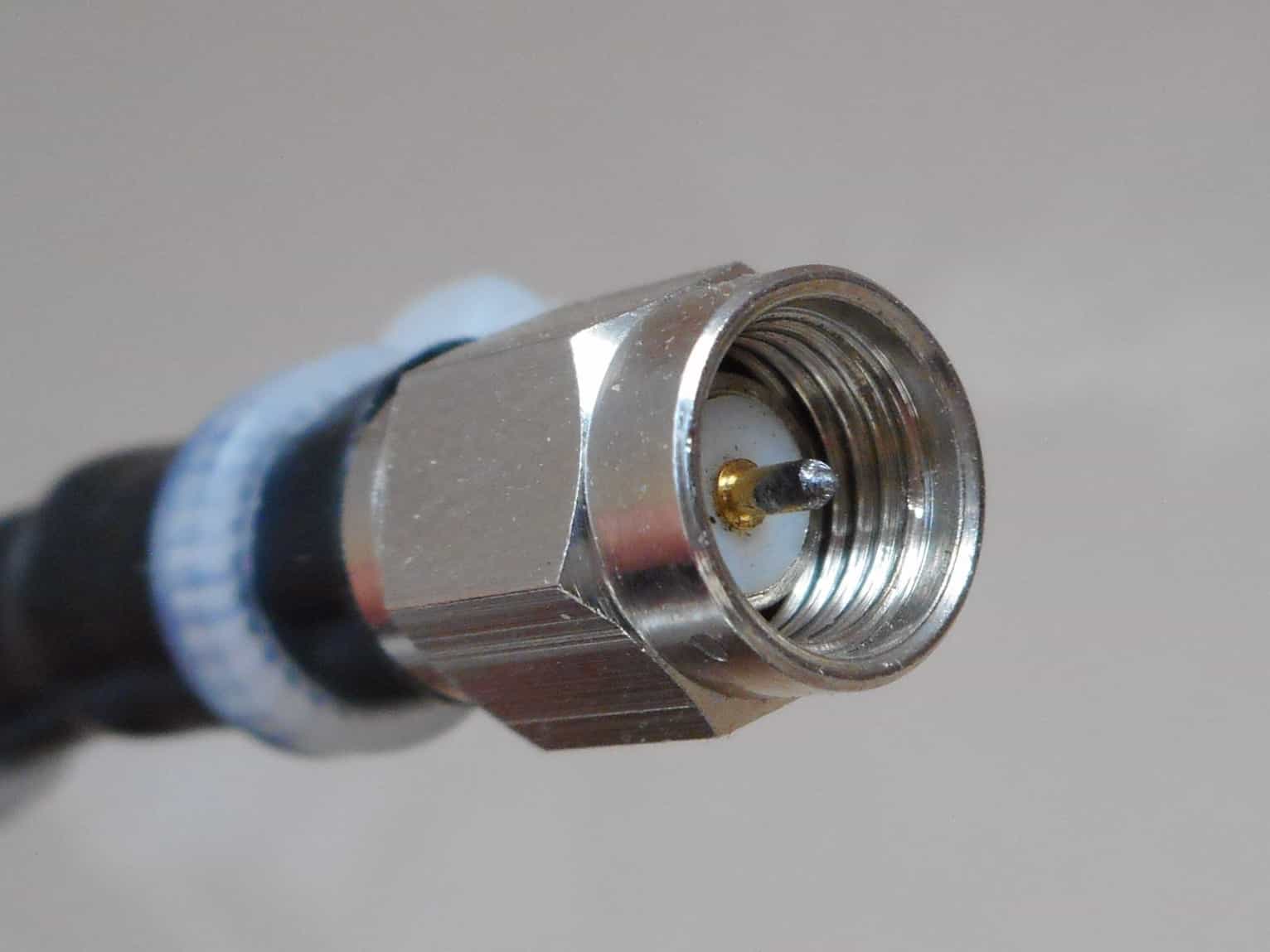 SMA male connector macro on coaxial cable; typical interconnect used in RF test setups.