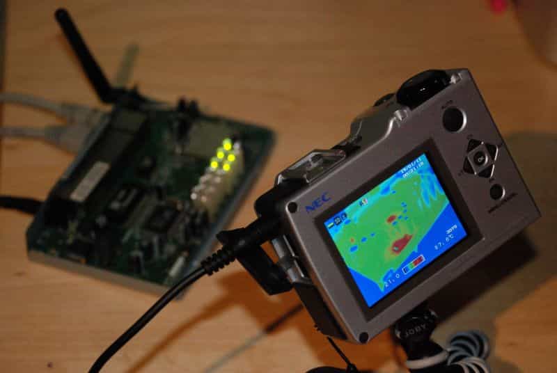 Thermal imaging camera showing a heat map on electronics, illustrating temperature hotspots during operation.